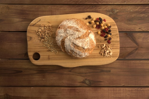 Baked bread on wooden board